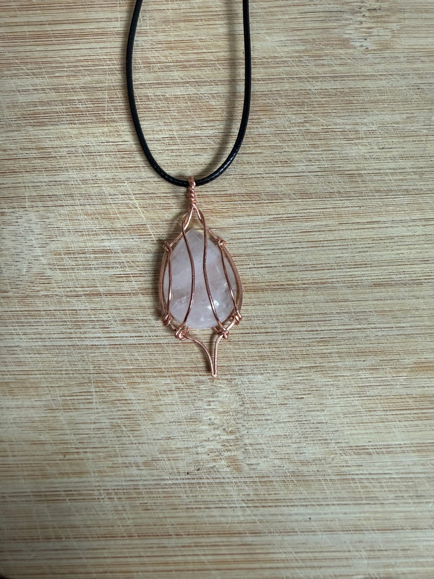 Copper wrapped rose quartz stone pendant