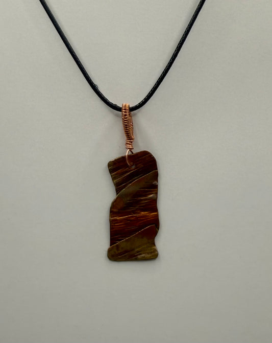 Fold formed, heat coloured, textured copper pendant