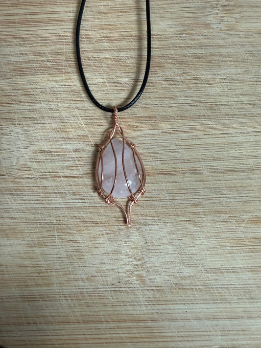 Copper wrapped rose quartz stone pendant